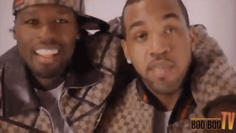Two Men Are Posing For A Picture With The Words Boo Boo Tv In The Background GIF