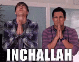 Two Men Are Praying With Their Hands Folded In Front Of A Sign That Says Inchallah . GIF