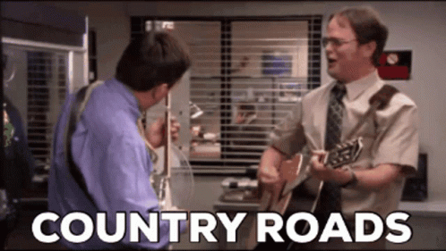 Two Men Are Singing And Playing Guitars With The Words Country Roads Written Below Them GIF