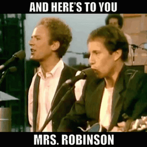 Two Men Are Singing Into Microphones While Playing Guitars On Stage . GIF