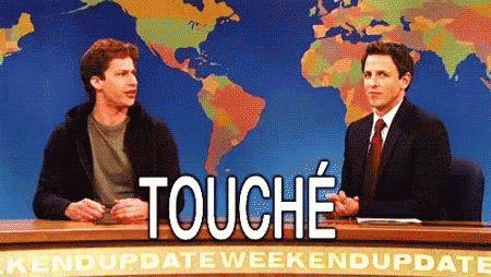 Two Men Are Sitting At A Desk With A Sign That Says " Touche " GIF