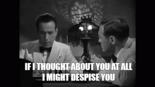 two men are sitting at a table and one of them is saying if i thought about you at all i might despise you