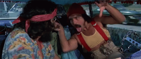Two Men Are Sitting In A Car And One Is Sticking His Tongue Out . GIF