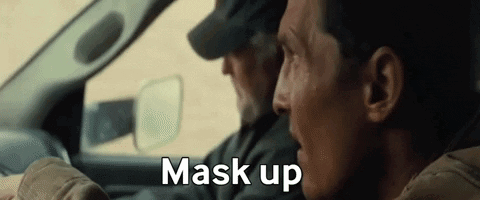 Two Men Are Sitting In A Car And One Of Them Is Saying Mask Up . GIF