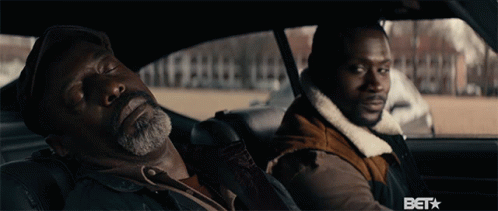 Two Men Are Sitting In A Car With The Word Bet On The Bottom Right GIF