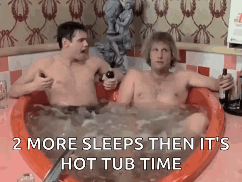 Two Men Are Sitting In A Hot Tub Holding Bottles Of Alcohol . GIF