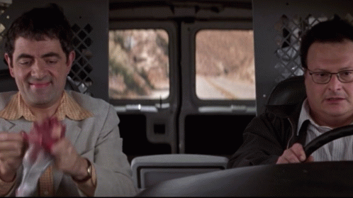 Two Men Are Sitting In A Van And One Has Glasses GIF