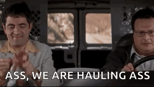 Two Men Are Sitting In A Van And One Of Them Is Saying `` Ass , We Are Haulng Ass '' . GIF