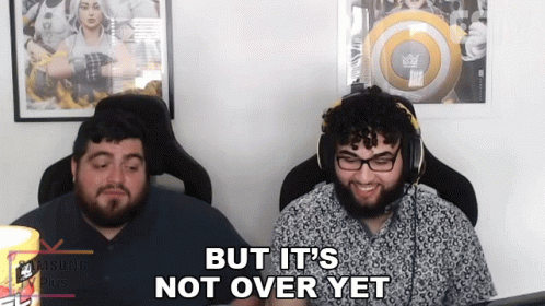 Two Men Are Sitting In Front Of A Computer With The Words But It 'S Not Over Yet GIF