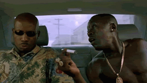 Two Men Are Sitting In The Back Seat Of A Car Smoking Cigarettes And Talking . GIF