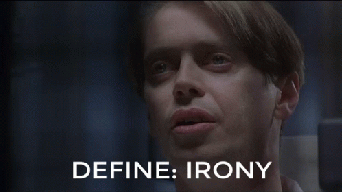Two Men Are Sitting Next To Each Other And The Words Define Irony Are Visible GIF