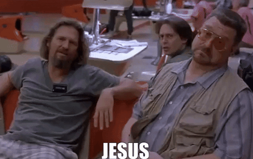 Two Men Are Sitting Next To Each Other In A Bowling Alley With The Word Jesus Written On The Screen . GIF