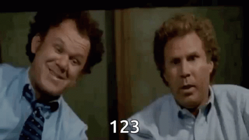 Two Men Are Sitting Next To Each Other In Front Of A Window And Smiling . One Of The Men Is Wearing A Tie . GIF