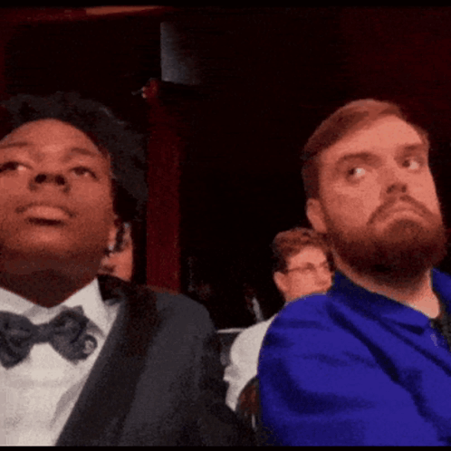 Two Men Are Sitting Next To Each Other With Ohio Stare Written On The Screen GIF