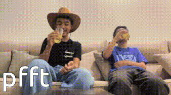 Two Men Are Sitting On A Couch Drinking Beer And One Of Them Has The Word Pfft On The Bottom GIF