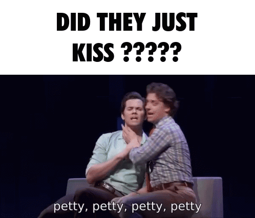 Two Men Are Sitting On A Couch With The Words Did They Just Kiss Behind Them GIF