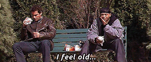 Two Men Are Sitting On A Park Bench And One Of Them Is Saying " I Feel Old " GIF