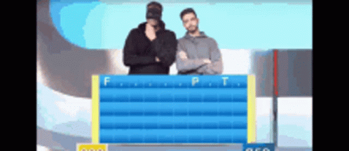 Two Men Are Standing In Front Of A Board With The Letters F And P On It GIF