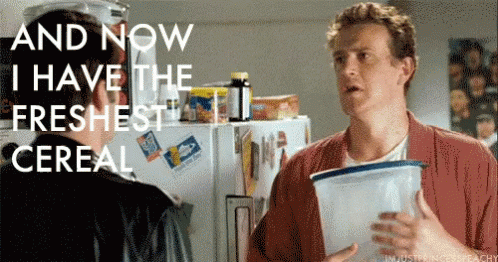 Two Men Are Standing In Front Of A Refrigerator With The Words And Now I Have The Freshest Cereal Written On It GIF