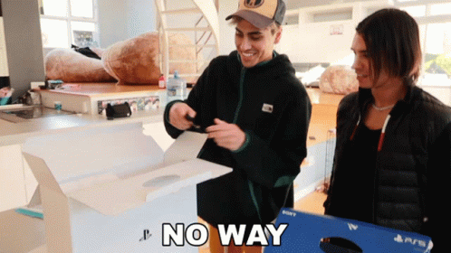 Two Men Are Standing Next To A Box That Says " No Way " GIF