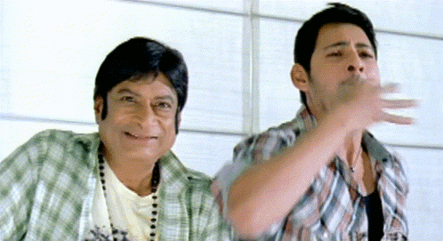 Two Men Are Standing Next To Each Other And One Is Wearing A Shirt That Says ' X ' On It GIF