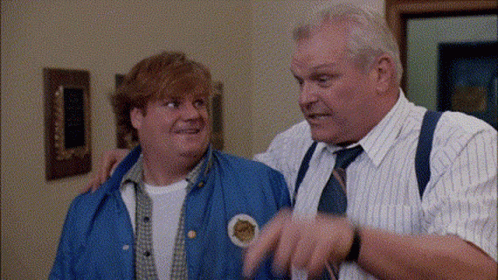 Two Men Are Standing Next To Each Other And One Of Them Has A Patch On His Jacket That Says ' A ' On It . GIF
