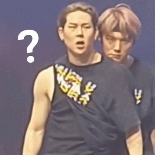 Two Men Are Standing Next To Each Other And One Of Them Has A Question Mark Above His Head GIF