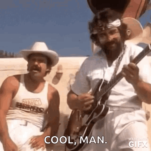 Two Men Are Standing Next To Each Other And One Of Them Is Holding A Guitar . GIF