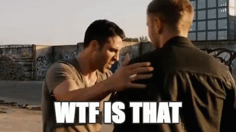 Two Men Are Standing Next To Each Other And One Of Them Is Holding The Other 'S Arm . GIF