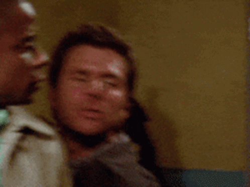 Two Men Are Standing Next To Each Other And One Of Them Is Saying Hold Me Back ! GIF
