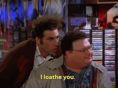 Two Men Are Standing Next To Each Other And One Of Them Is Saying I Loathe You GIF
