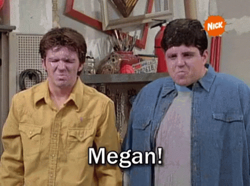Two Men Are Standing Next To Each Other And One Of Them Is Saying Megan ! GIF