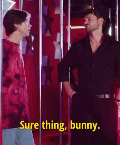 Two Men Are Standing Next To Each Other And One Of Them Is Saying Sure Thing Bunny . GIF