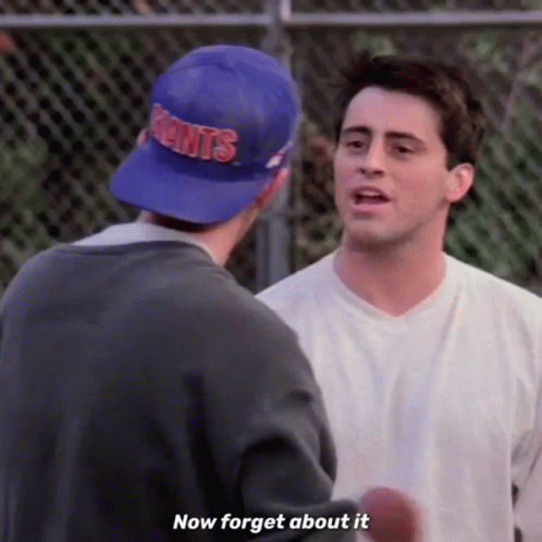 Two Men Are Standing Next To Each Other And One Of Them Is Wearing A Blue Hat That Says Giants . GIF