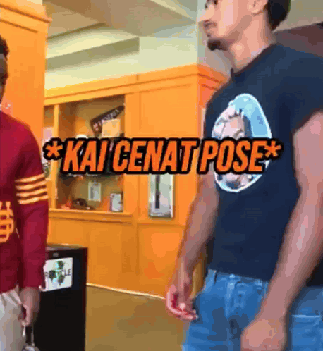 Two Men Are Standing Next To Each Other And One Of Them Is Wearing A Kai Cenat Pose Shirt GIF