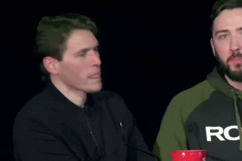Two Men Are Standing Next To Each Other And One Of Them Is Wearing A Sweatshirt That Says Rog On It . GIF