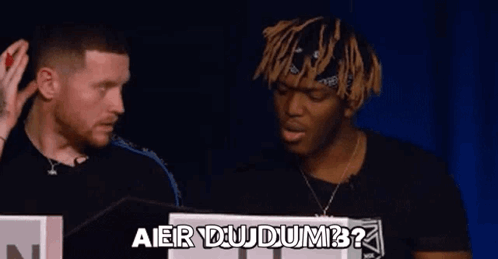 Two Men Are Standing Next To Each Other And Talking . GIF