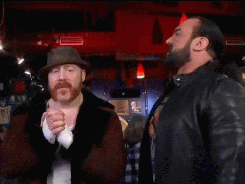 Two Men Are Standing Next To Each Other And The Word Banger Is On The Bottom GIF