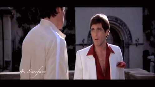 Two Men Are Standing Next To Each Other And The Word Scarface Is On The Bottom GIF