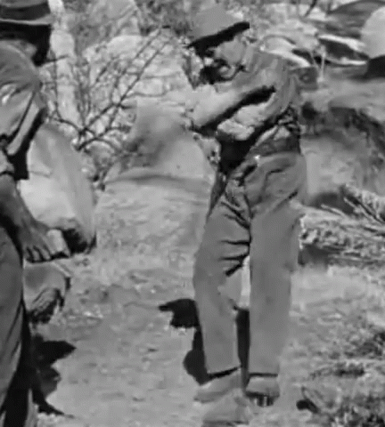 Two Men Are Standing Next To Each Other In A Black And White Photo . GIF