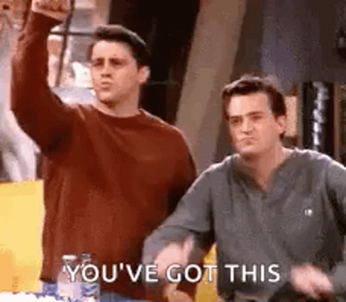 Two Men Are Standing Next To Each Other In A Room . GIF
