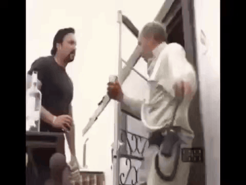 Two Men Are Standing Next To Each Other In Front Of A Building . One Of The Men Is Holding A Ladder . GIF