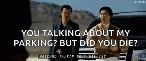 Two Men Are Standing Next To Each Other In Front Of A Car Talking About Parking . GIF