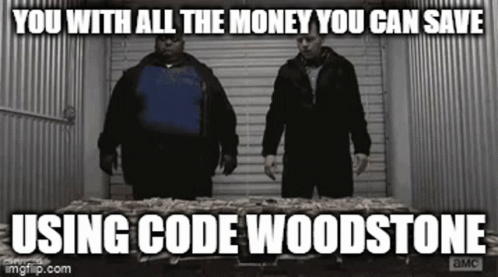 Two Men Are Standing Next To Each Other In Front Of A Table Filled With Money . GIF