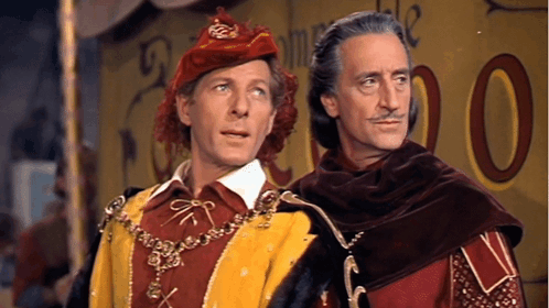 Two Men Are Standing Next To Each Other In Front Of A Yellow Sign That Says 00 GIF
