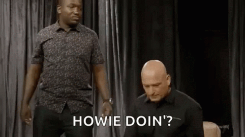 Two Men Are Standing Next To Each Other On A Stage And One Of Them Is Asking The Other To Do Something . GIF