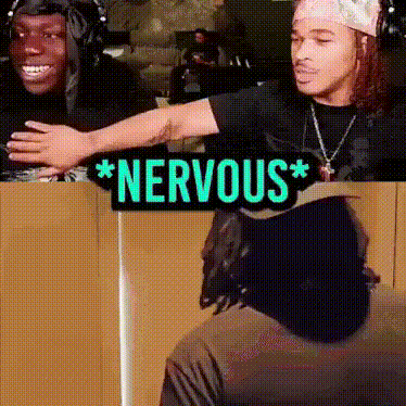 Two Men Are Standing Next To Each Other With A Sign That Says * Nervous * GIF