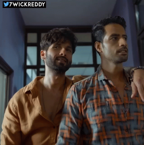 Two Men Are Standing Next To Each Other With A Wickreddy Logo In The Background GIF