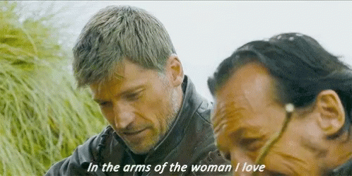Two Men Are Standing Next To Each Other With One Saying In The Arms Of The Woman I Love GIF