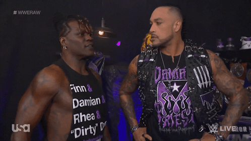Two Men Are Standing Next To Each Other With One Wearing A Shirt That Says Dirty GIF